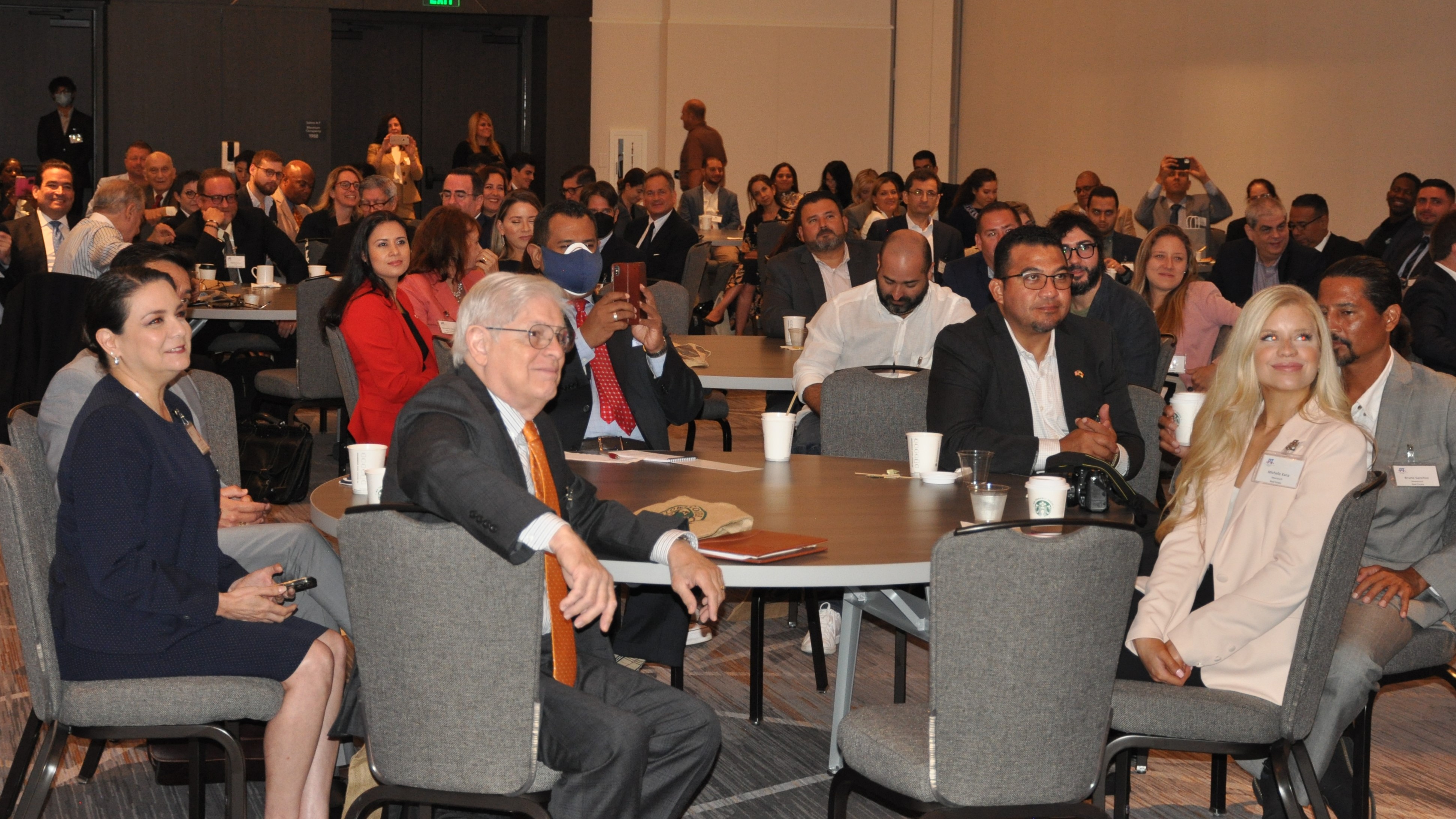 STI Team Members Listen In To Speakers