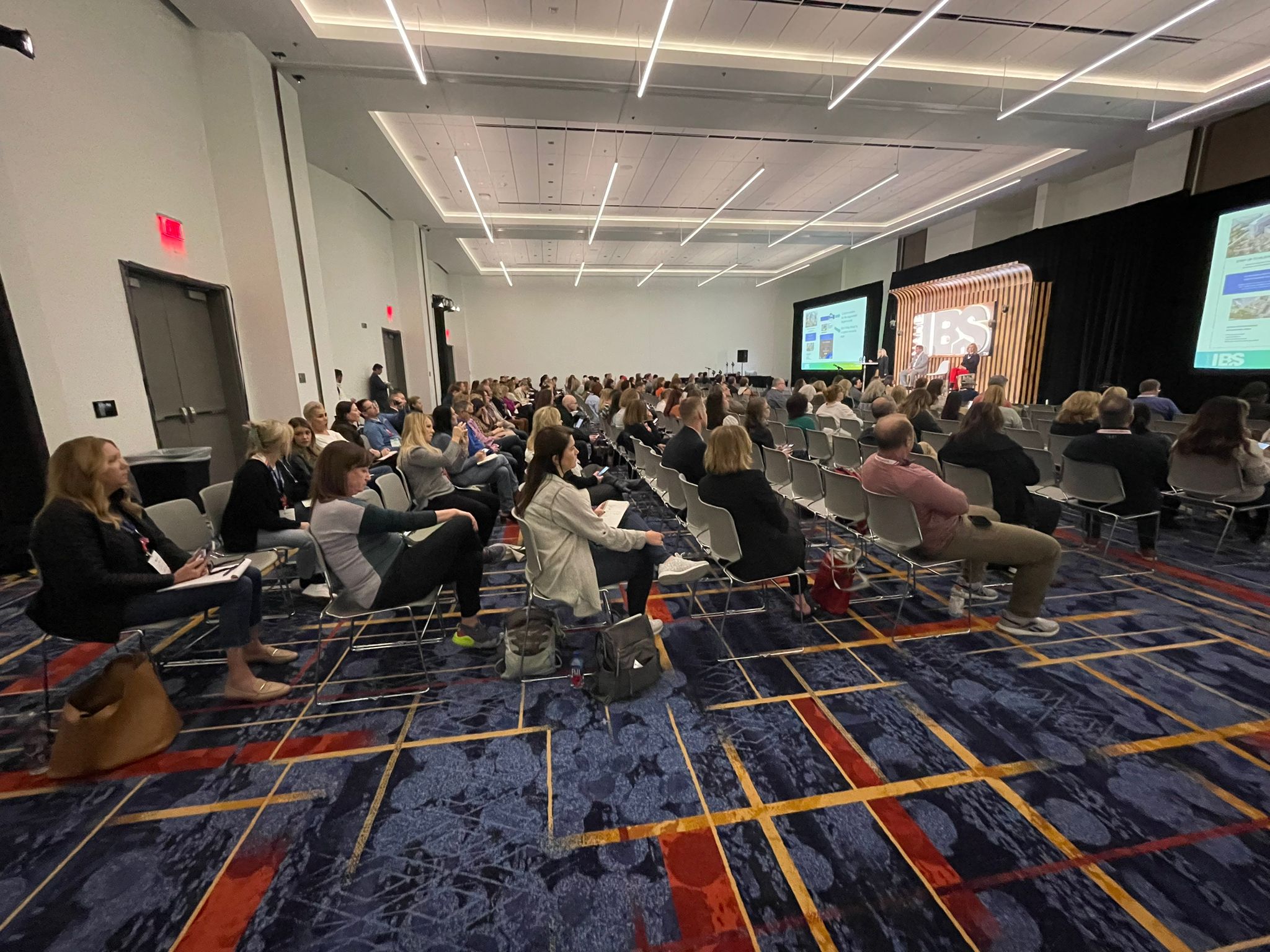 Crowd listening to presentation at IBS 2023 Conference