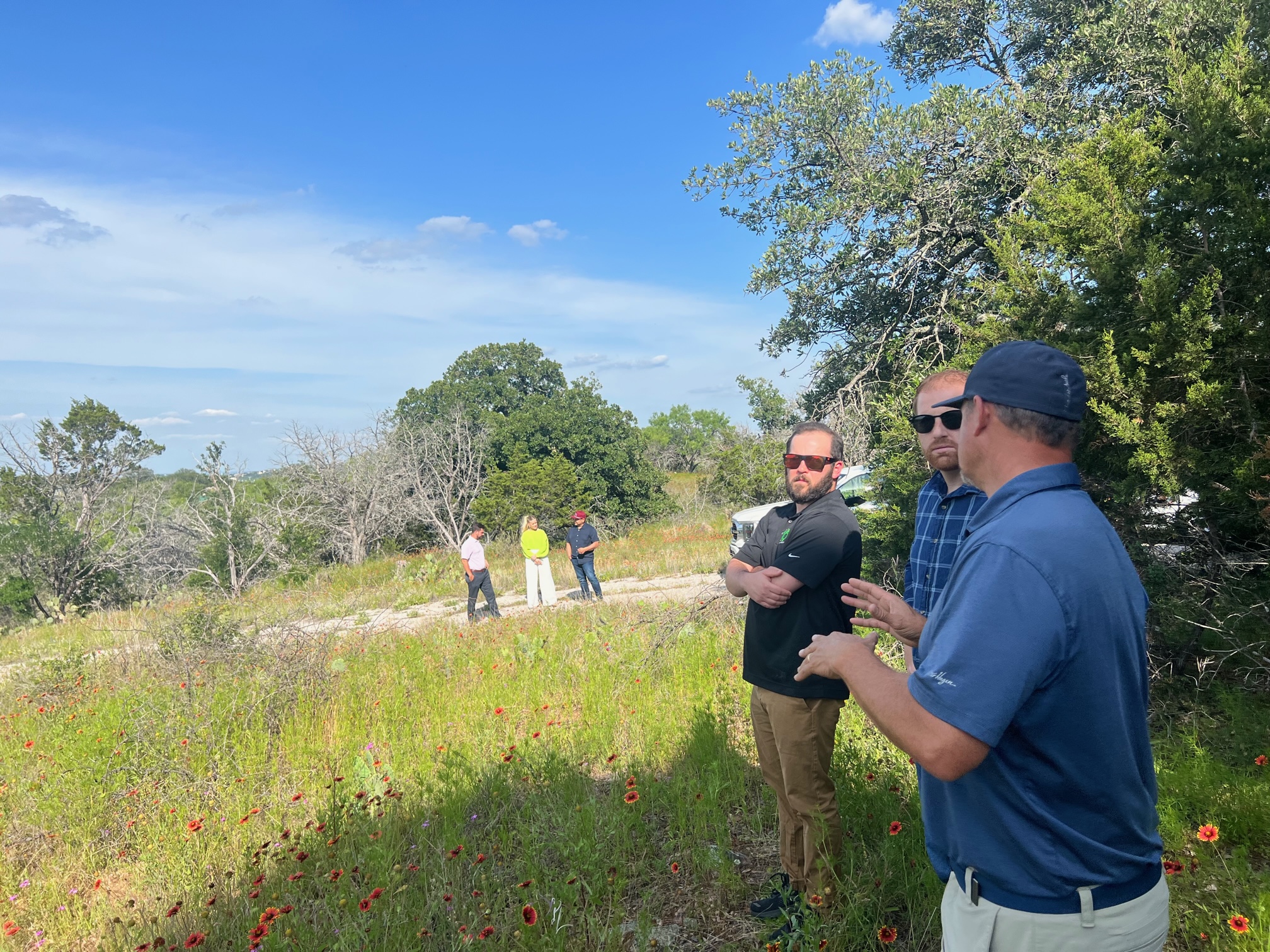 The SmartTouch leadership team confers with Modern Homestead CEO during a site tour. 