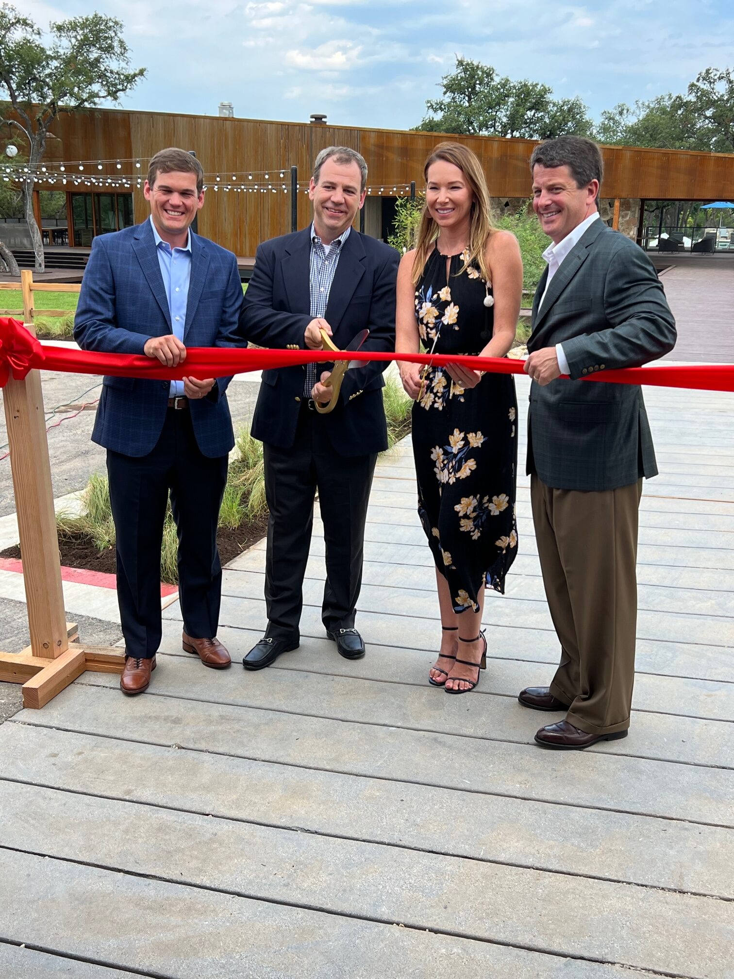 Wolf Ranch community leaders preparing to cut the ribbon at the River Camp amenity grand opening