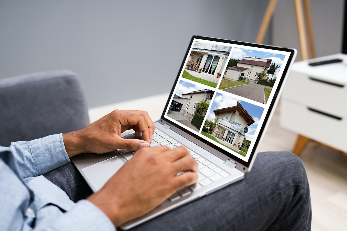 Man Selecting Real Estate House Online